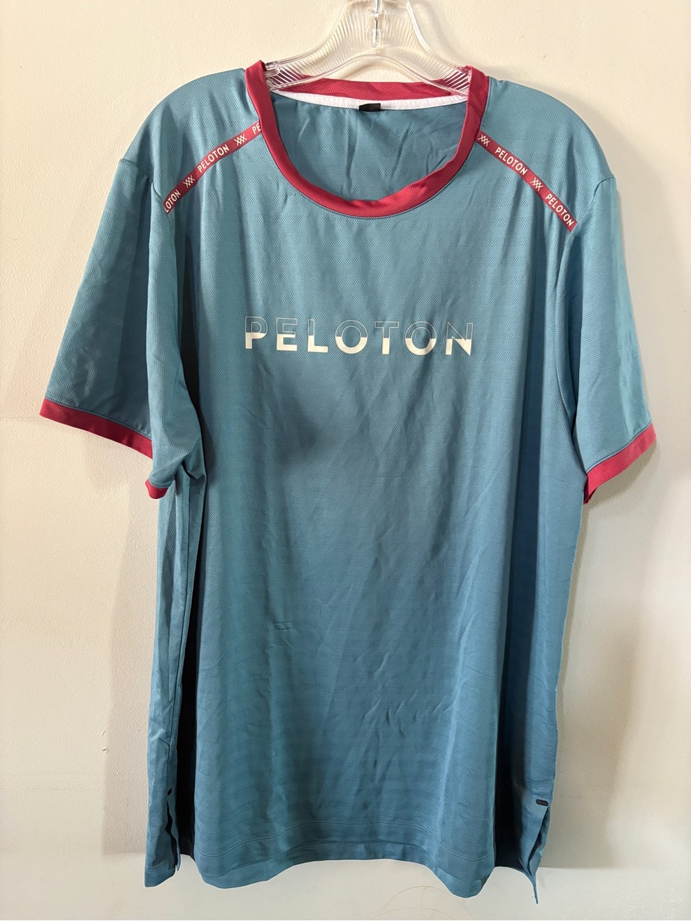 Peloton Men’s Teal Performance Tee with Pink Trim